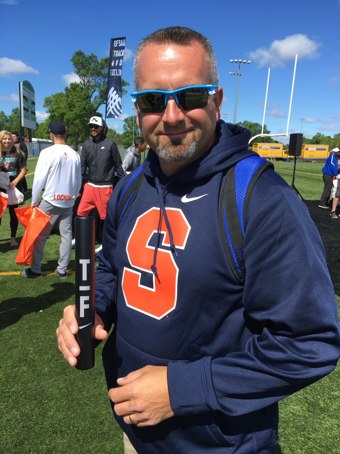 Rob Moore coaching track and field